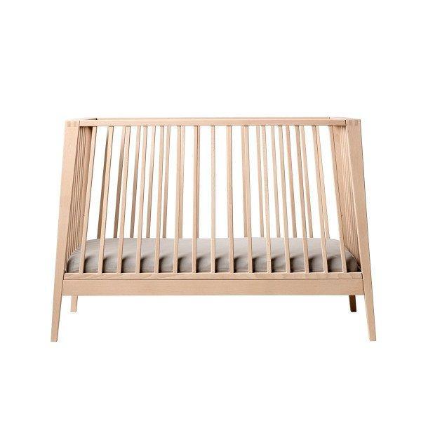 Wooden baby crib from Leander Linea Cot with comfort mattress for cozy naps