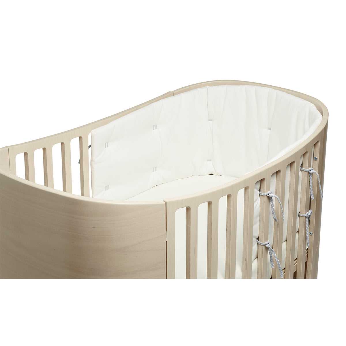 Oval wooden baby crib with white padded liner for Toshi Baby Organic Classic Cot Bumper