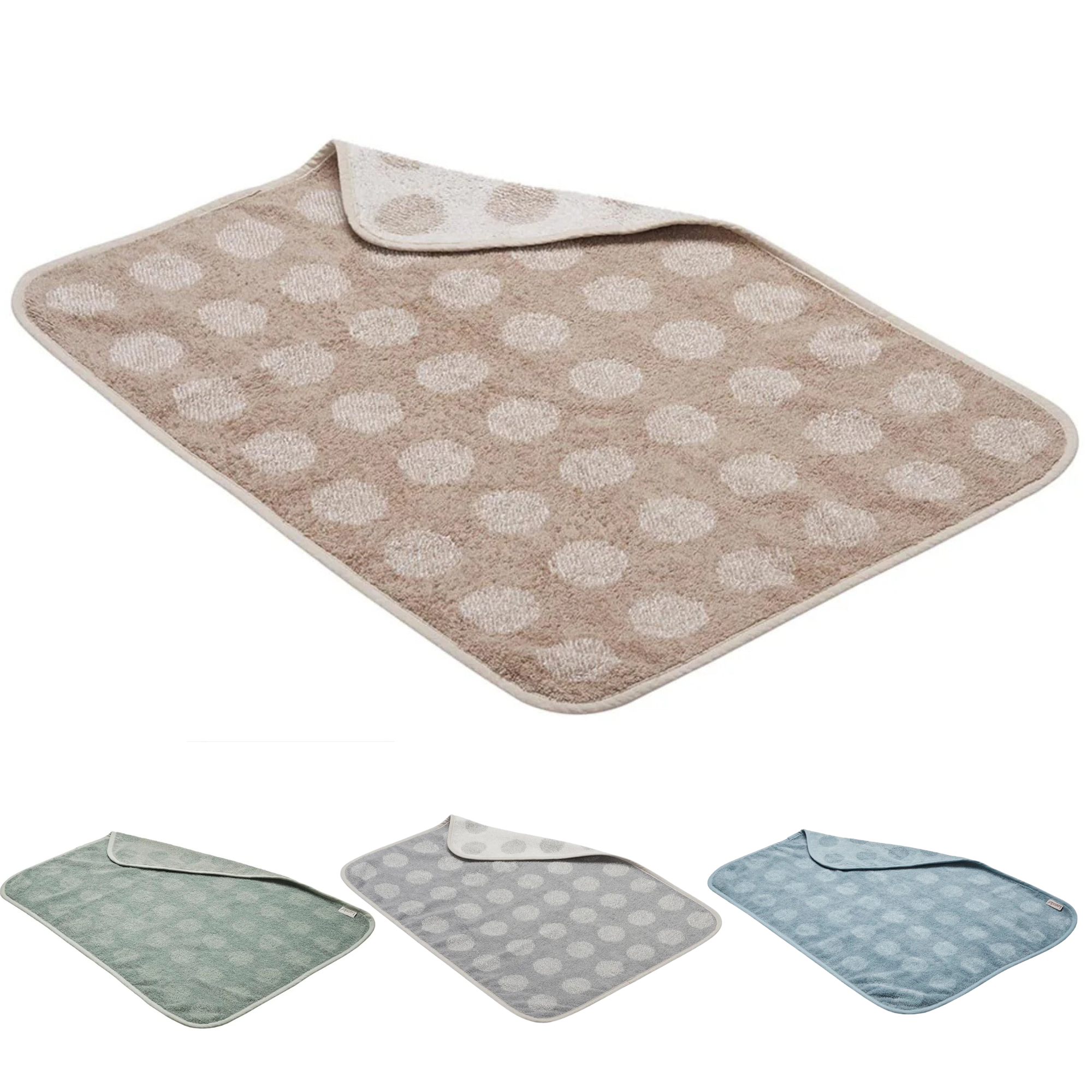 Reversible polka-dotted baby changing mat on Leander Organic Matty Topper for Toshi Baby