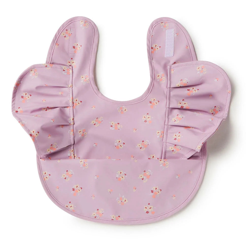 Cute floral-patterned lilac bloom frill snuggle bib with ruffled sleeves from Snuggle Hunny Bibs