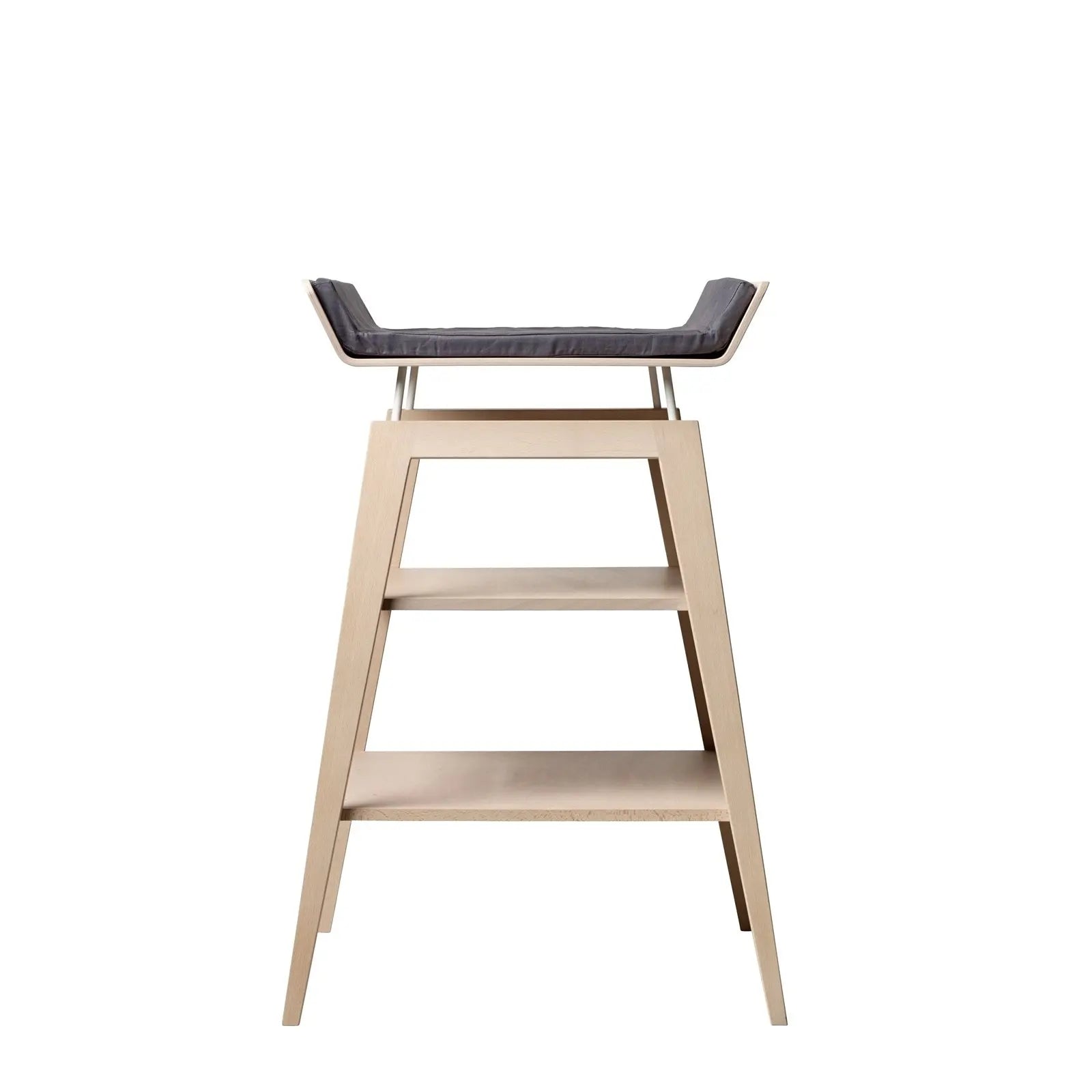 Linea Change Table by Toshi Baby with wooden stool, gray cushion, and shelves design