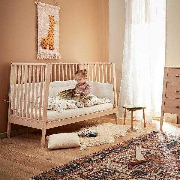 Wooden toshi baby crib with child in Linea Cot Natural 120cm, perfect cot natural 120cm style