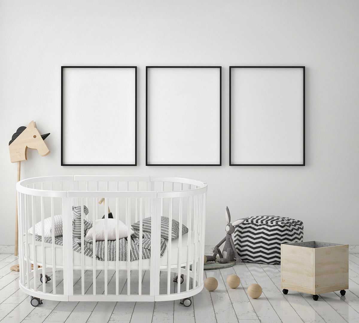 Lolli Sprout Cot 4 in 1 WHITE with Mattress in a nursery with round crib and framed art