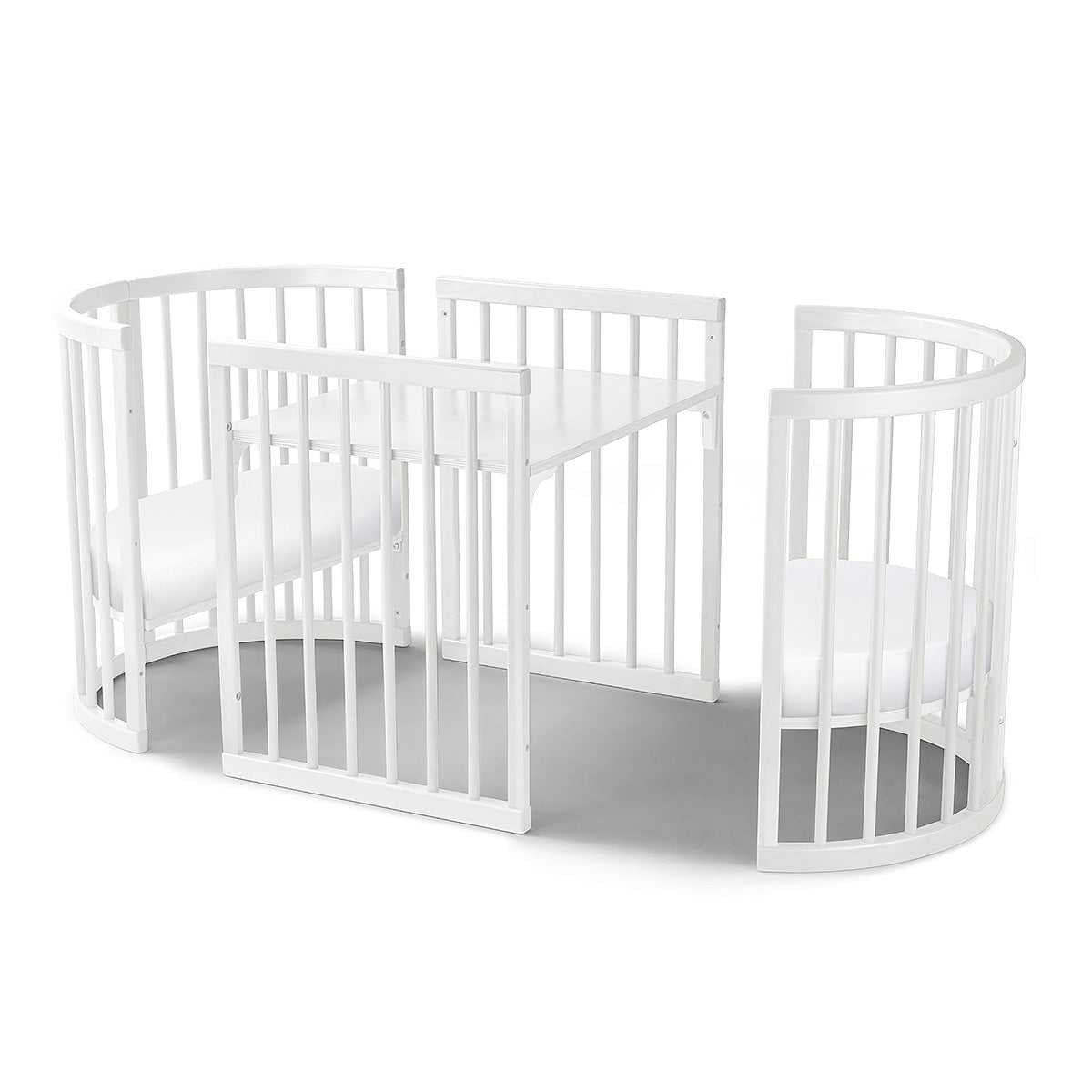 White round Lolli Sprout Cot made of European Beech Wood with mattress for babies