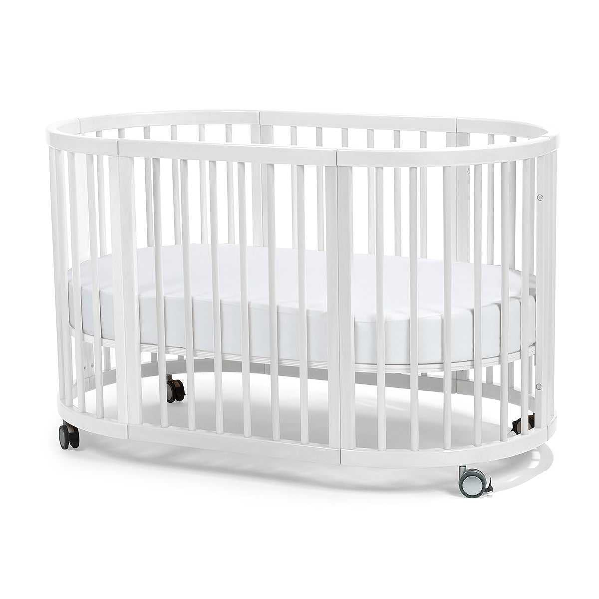 White oval baby crib with wheels from Lolli Sprout Cot 4 in 1 WHITE with Mattress