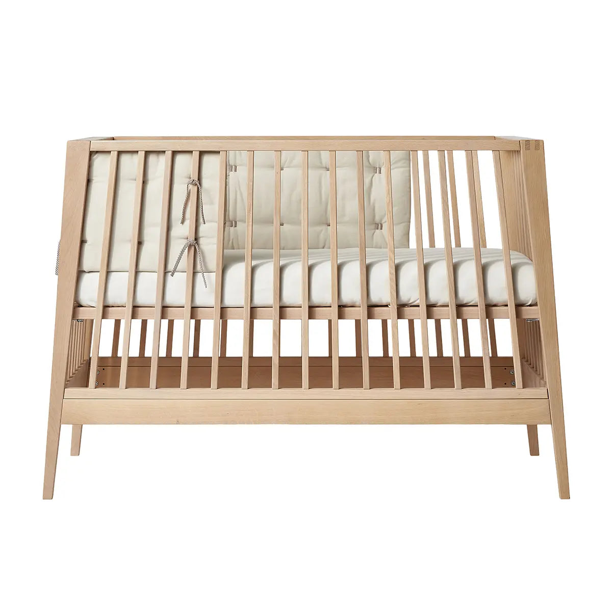 Wooden baby crib with padded sides from Leander Organic Linea Luna Cot Bumper for Toshi Baby