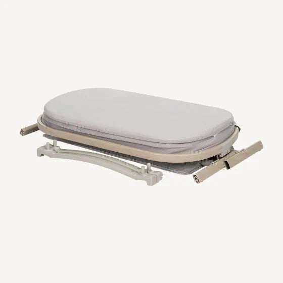 Folded ironing board near Maxi Cosi Iora Air Bedside Sleeper, great for toshi baby and baby strollers setup