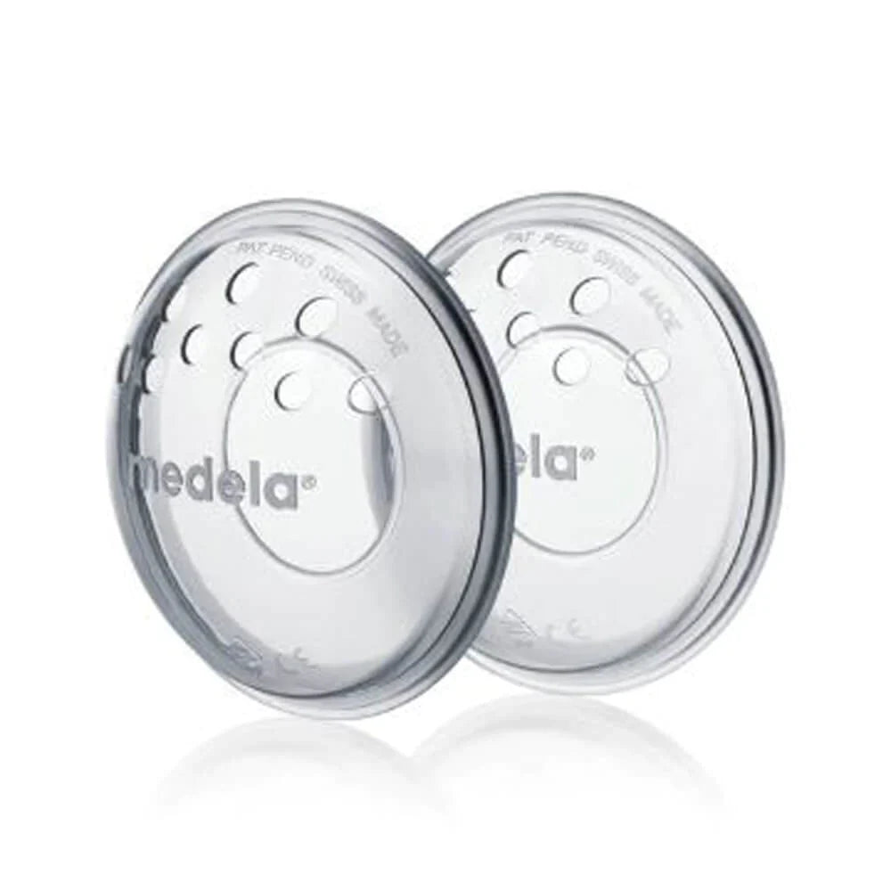 Two clear Medela Breastshells for gentle breast milk collection, perfect with a Toshi Baby Romper or Baby Romper Eva