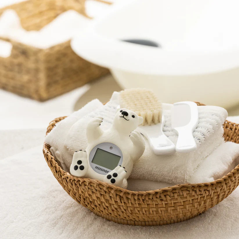 Polar bear-shaped Mininor Bath Thermometer in a basket, perfect for baby strollers and toshi baby romper crazy moms
