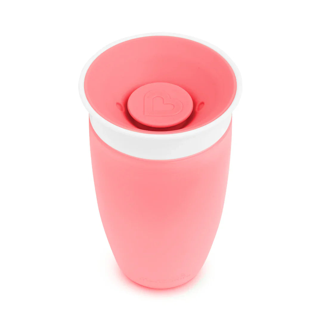 Pink spill-proof miracle 360° cup from Munchkin, perfect for odyssey wagon wheels toddlers