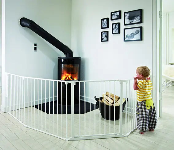 White safety gate surrounding a fireplace showcasing Babydan Flex Configure System Large WHITE