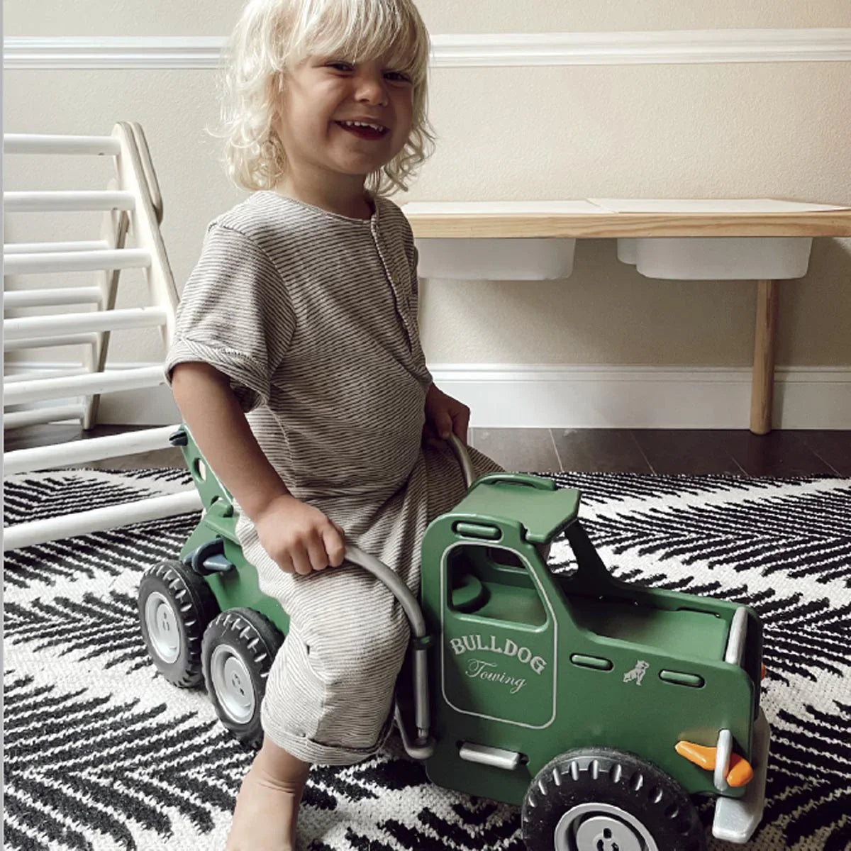 Green toy tow truck from Moover Classic Mack perfect for toshi baby and baby strollers