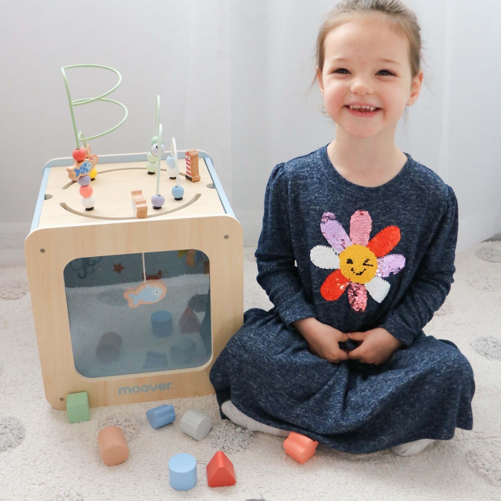 Wooden giant activity cube for Toshi Baby in light green from Moover Toys