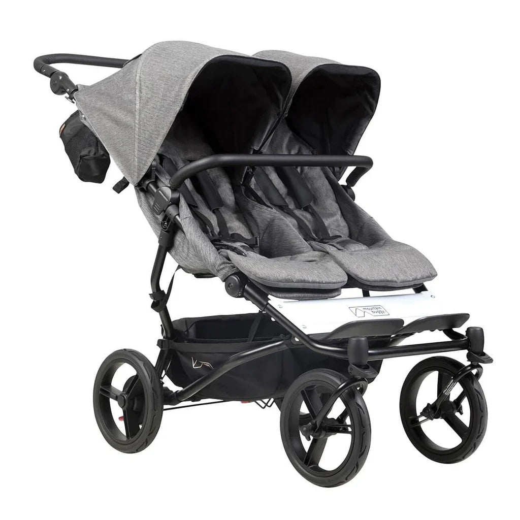 Gray double stroller from Mountain Buggy Duet luxury collection with double carrycot