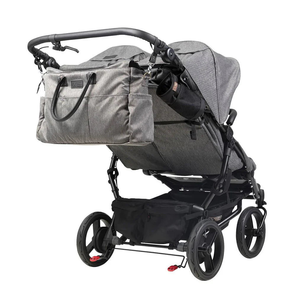 Gray double stroller with diaper bag from Mountain Buggy Duet™ luxury collection with single cocoon free warranty