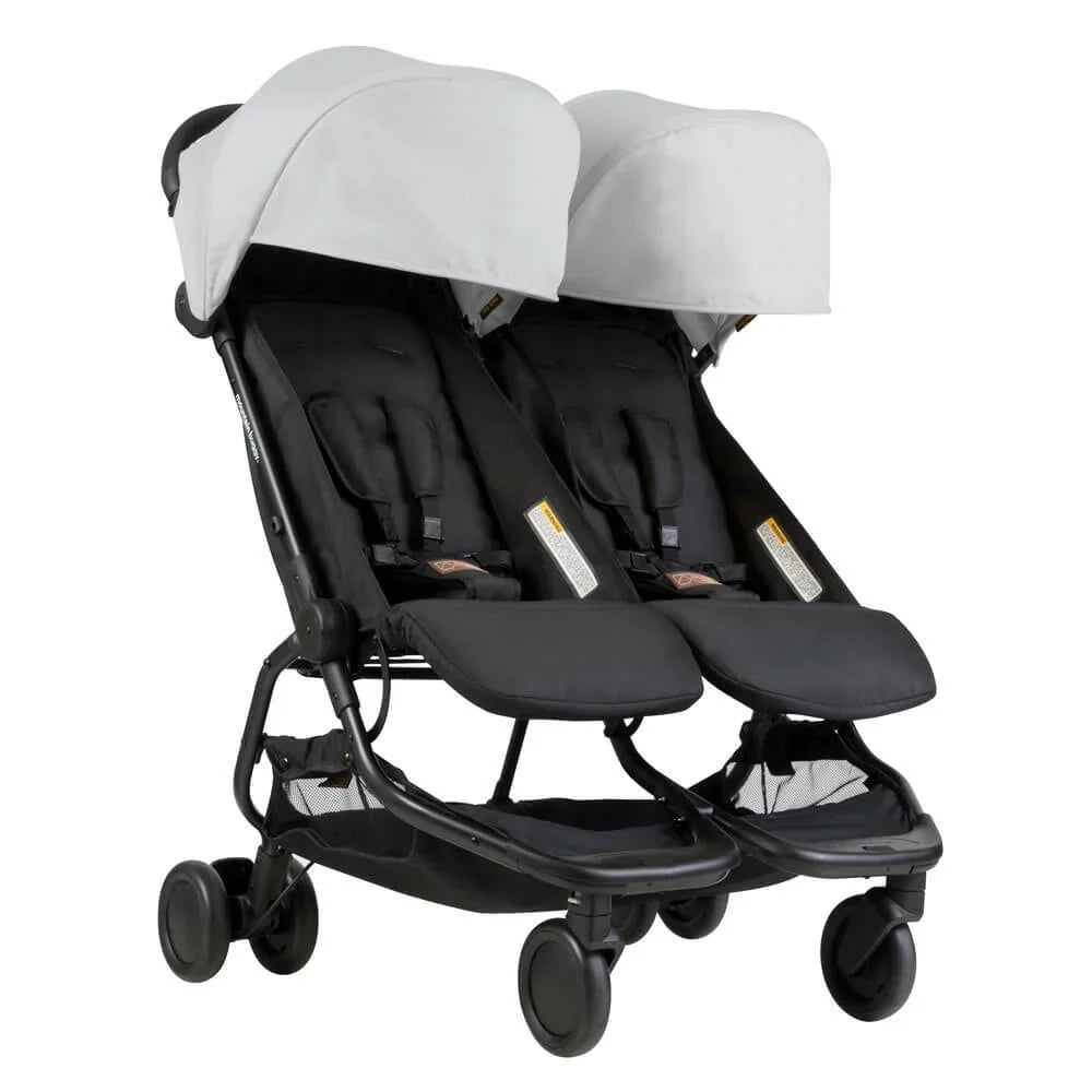 Black double stroller with gray canopies from Mountain Buggy Nano duo stroller gift set