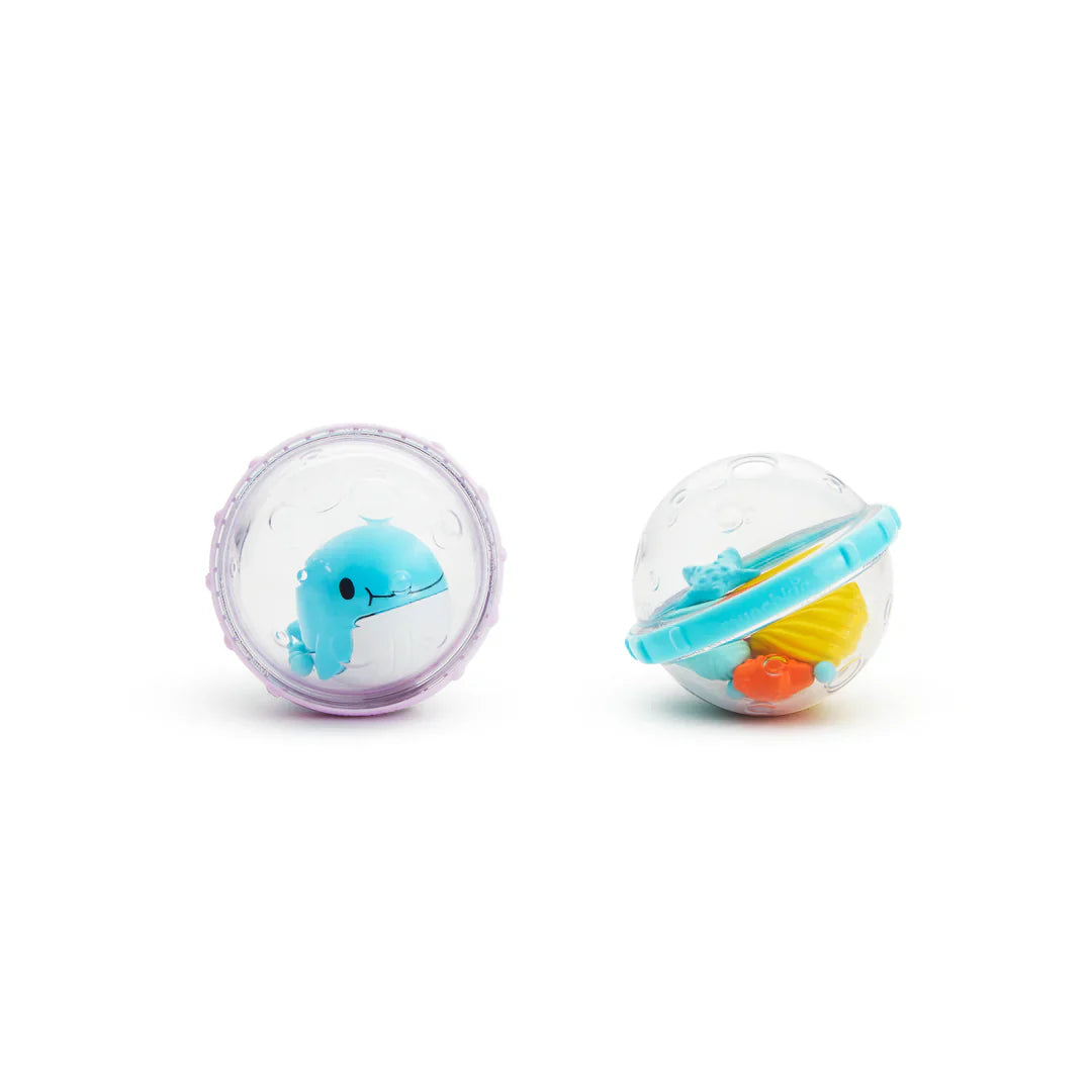 Two clear plastic baby rattles from Munchkin Float & Play Bubbles, perfect for Toshi Baby Romper fans