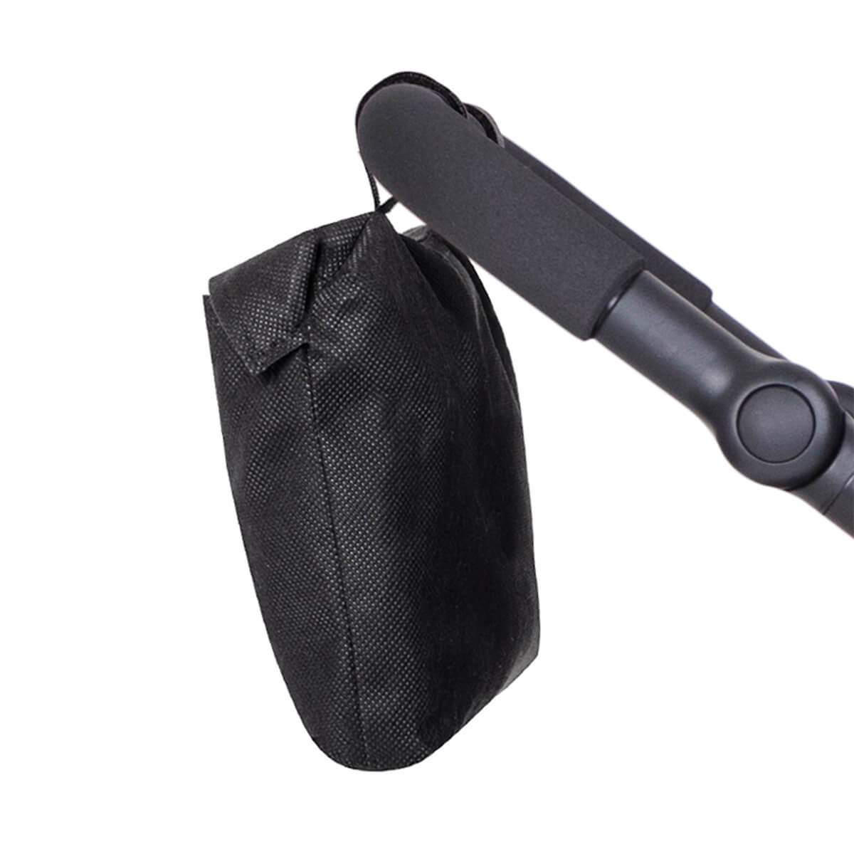 Black fabric bag hanging from stroller handle for Philteds Mesh Cover with Toshi Baby Romper