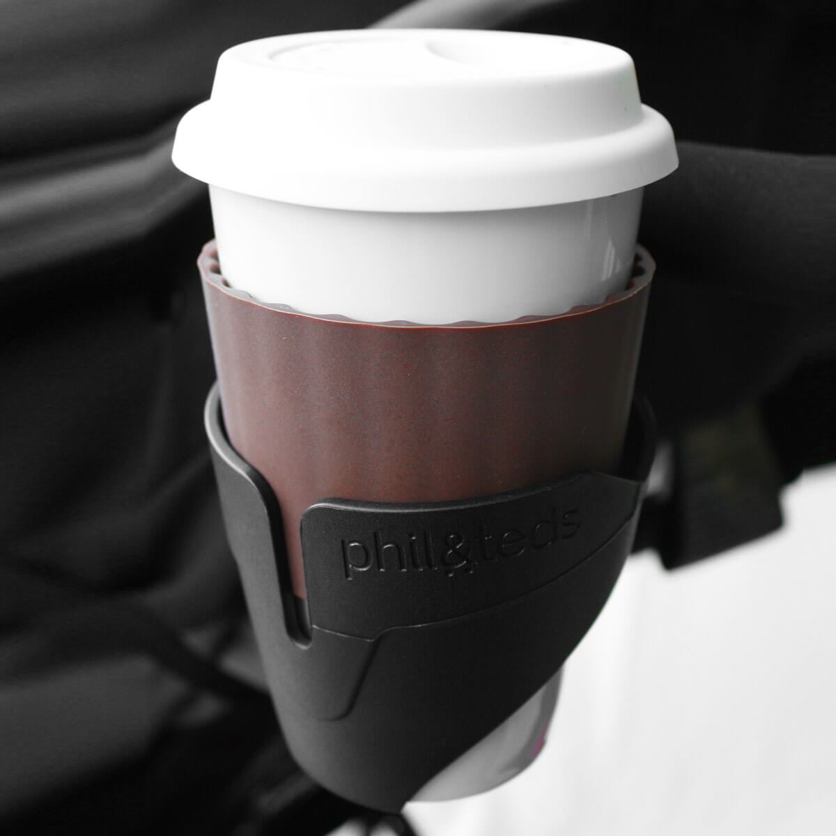 Coffee cup in a phil&teds cup holder on baby strollers, perfect for on-the-go moms