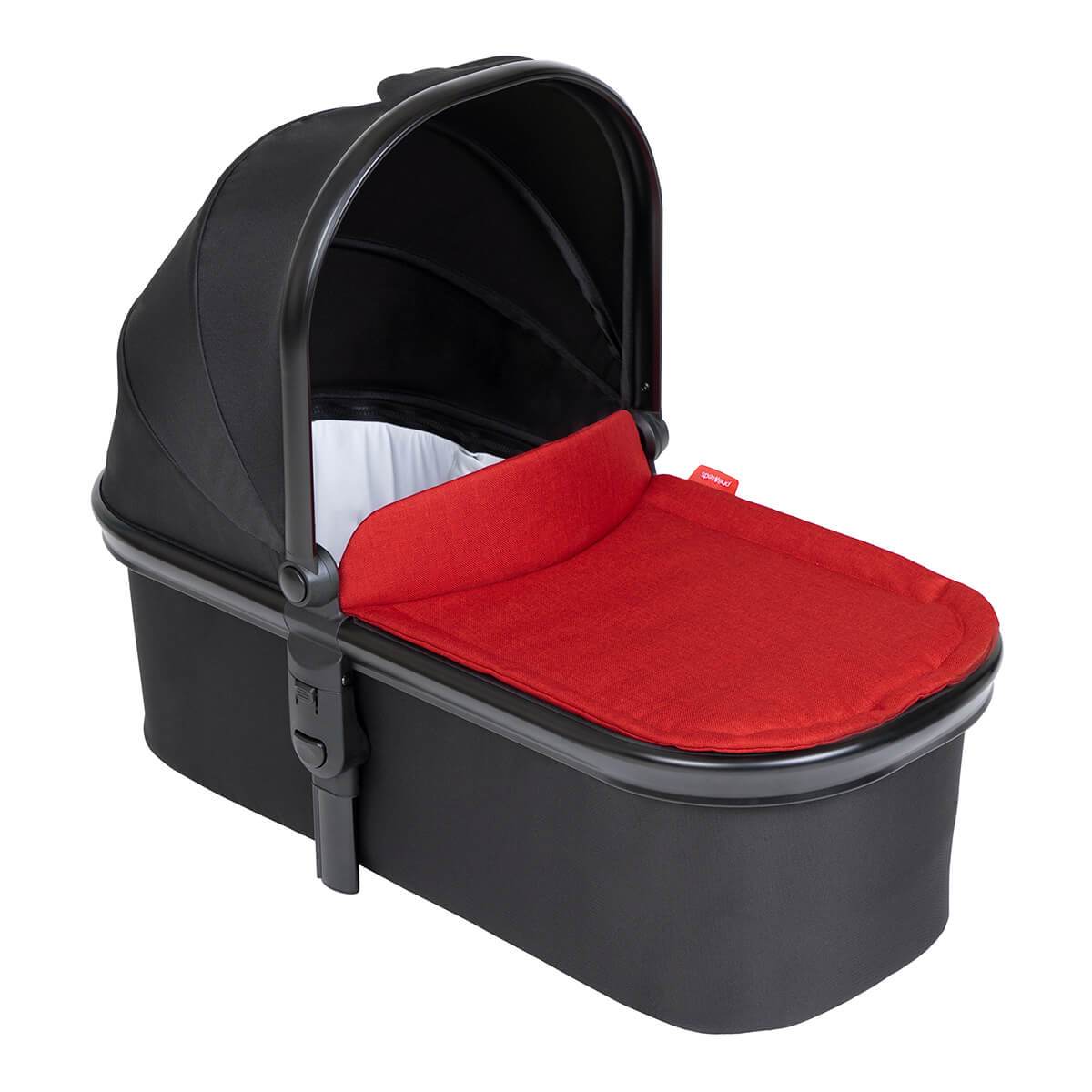 Black and red Phil&Teds Snug Carrycot perfect for bare mum postpartum on Odyssey wagon wheels