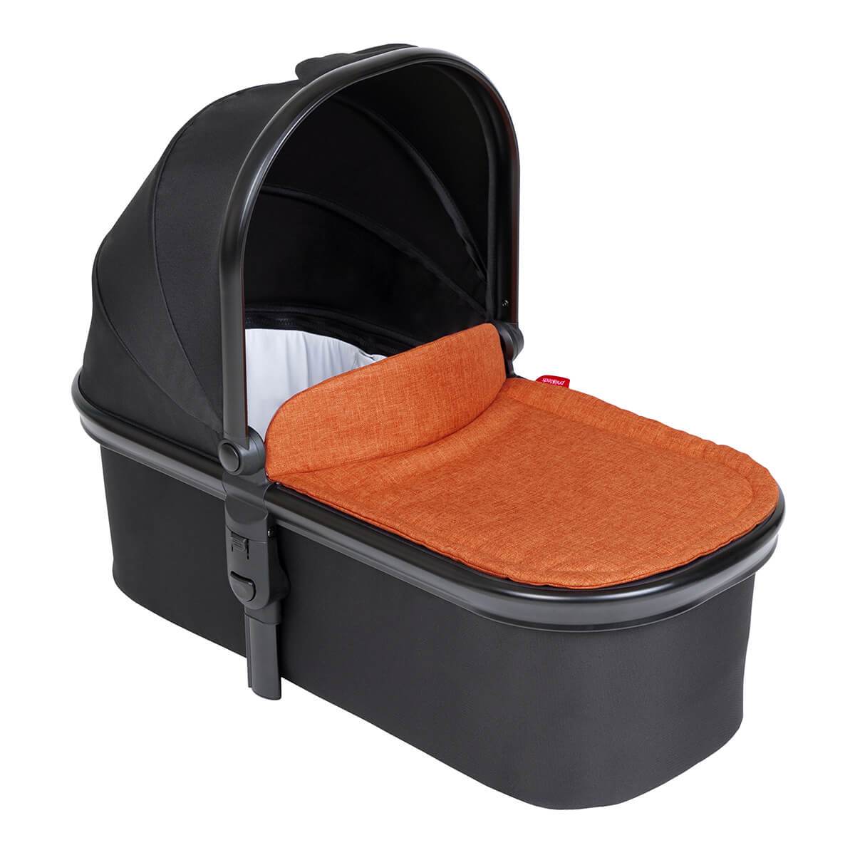 Black baby bassinet with orange cushion in Phil&Teds Snug Carrycot for comfy stroller naps