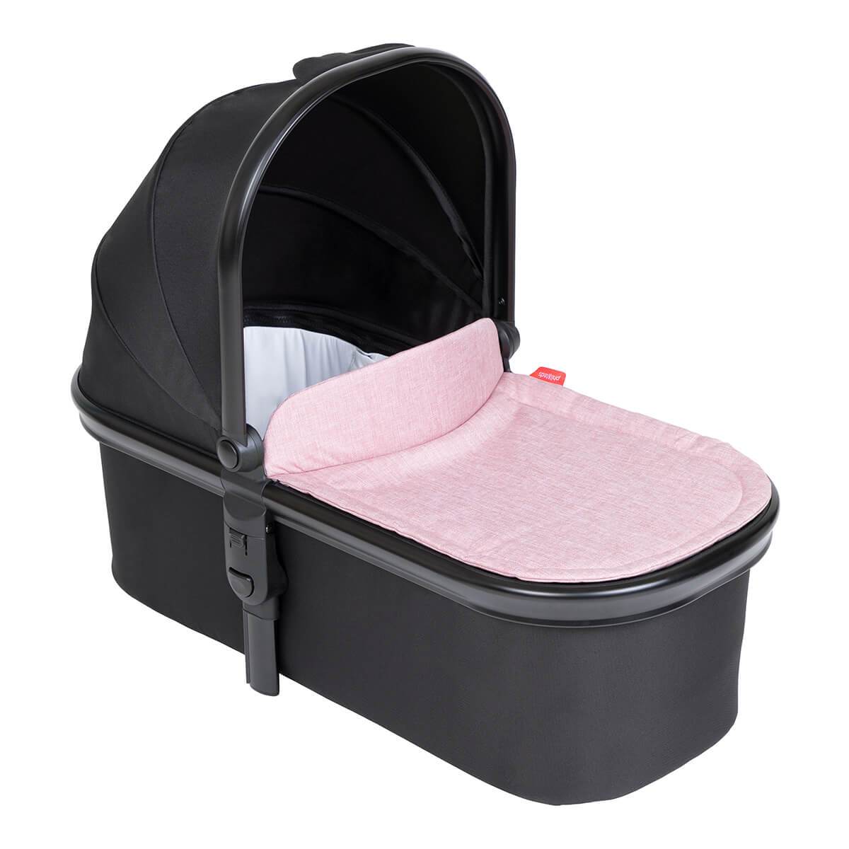 Black baby bassinet with pink mattress from Phil&Teds Snug Carrycot on Odyssey Wagon Wheels