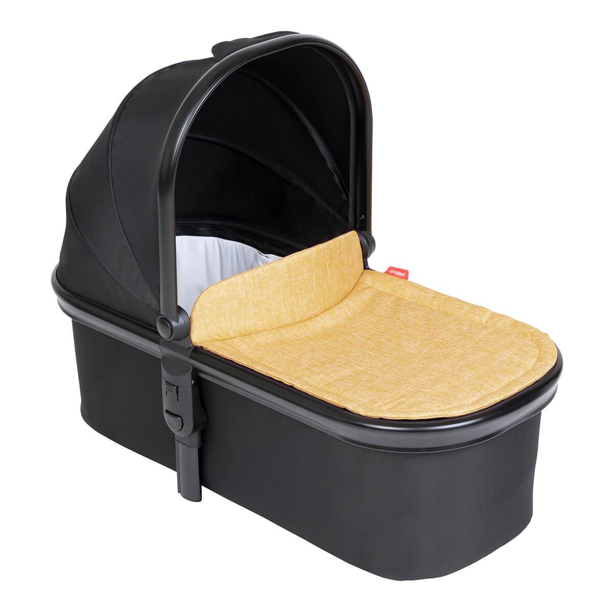 Black baby bassinet with tan interior in Phil&Teds Snug Carrycot for baby strollers