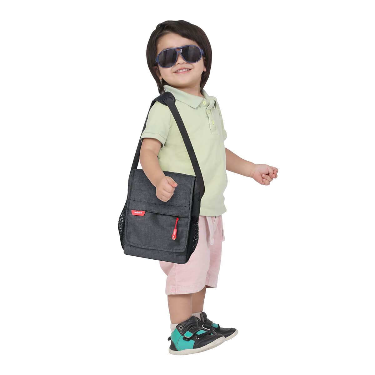 Child’s black messenger bag from Phil&Teds diddie with Toshi baby romper style look