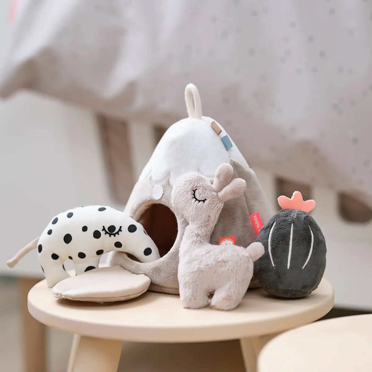 Assorted plush baby toys with Done by Deer Hide & Seek Mountain featuring Toshi Baby Romper