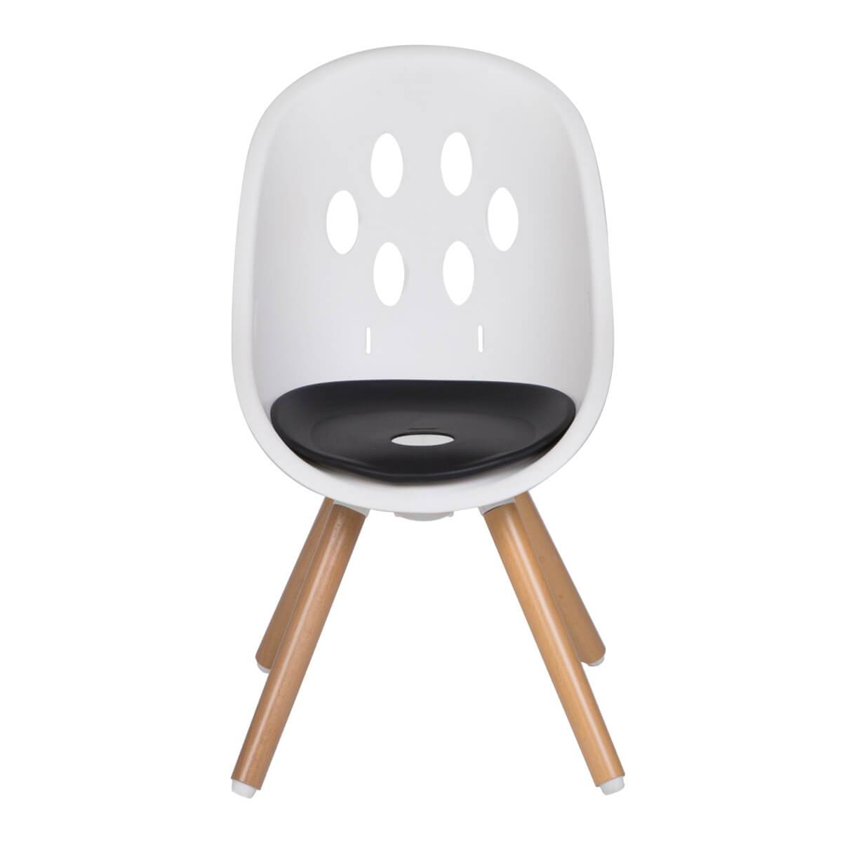 White chair with wooden legs and black cushion from Phil&Teds Poppy Wood Highchair
