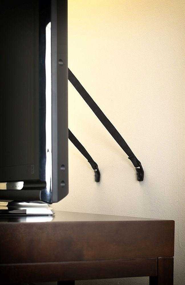 BabyDan Anti-Tip TV Strap securing flat-screen safe with straps on a TV setup