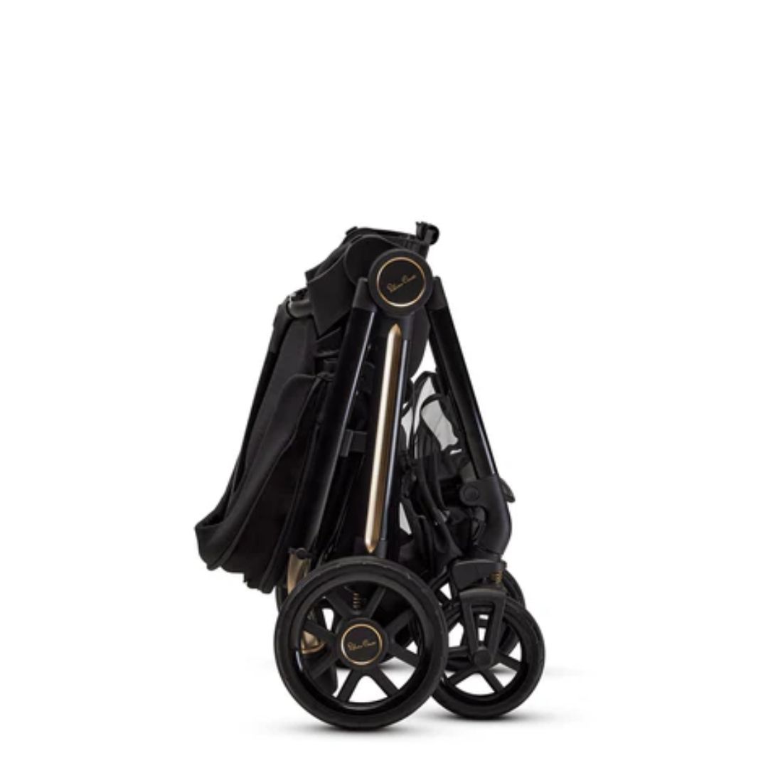 Folded black Silver Cross Reef stroller with toshi baby carrycot special edition