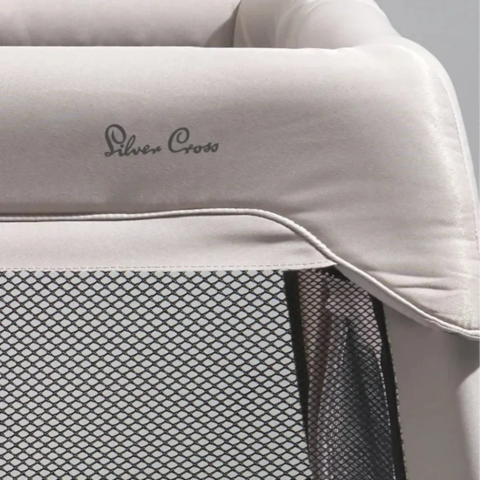 Gray baby crib with mesh sides from Silver Cross Slumber Travel Cot Stone, perfect for toshi baby needs