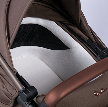 Brown stroller interior of Silver Cross Wave baby stroller with Toshi Baby accessories