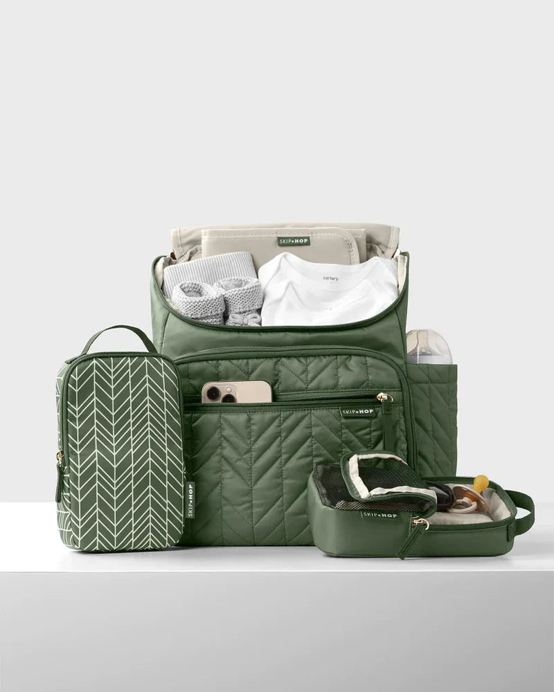 Green quilted Skip Hop Toshi Baby Forma Nappy Backpack with packing cubes and accessories