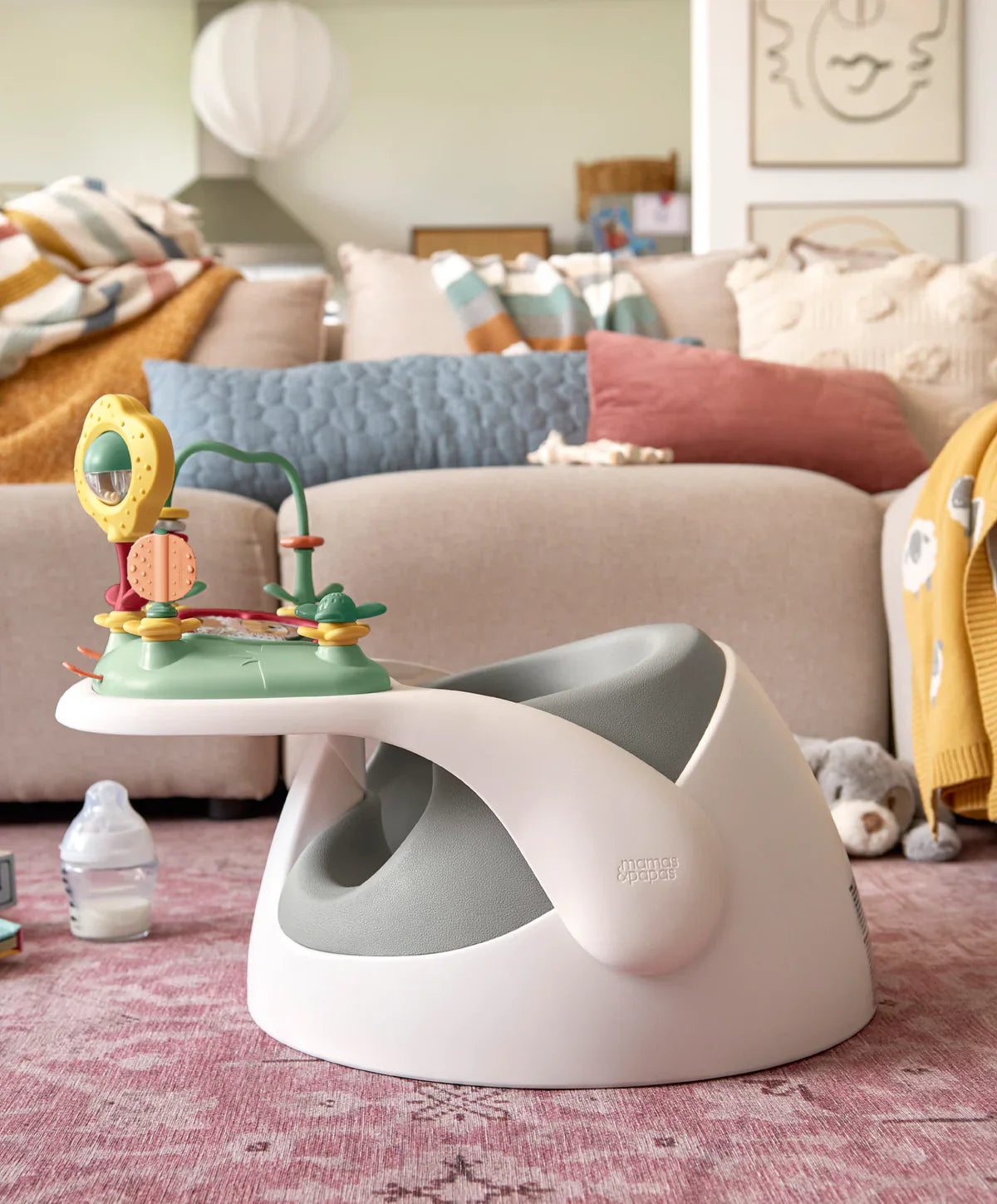 White and gray baby seat with toy for babies, great for use with Mamas & Papas Strollers