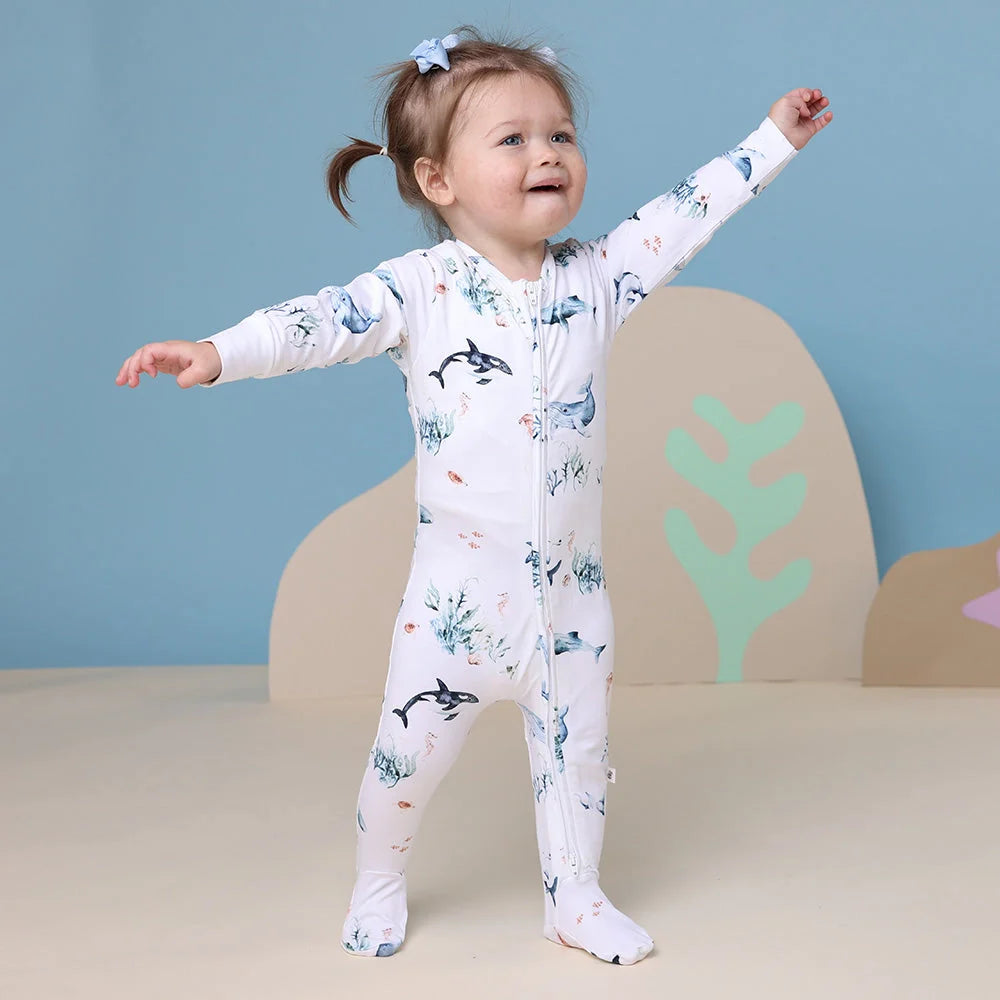 Child’s footed pajamas with ocean print from Snuggle Hunny Toshi Baby Growsuit