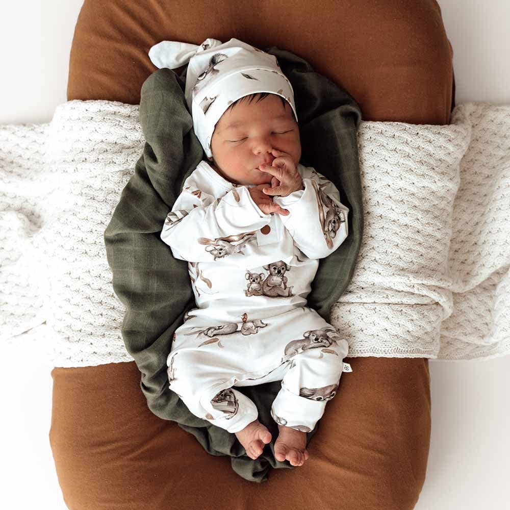 Sleeping baby in snuggle hunny koala organic growsuit, perfect for baby strollers