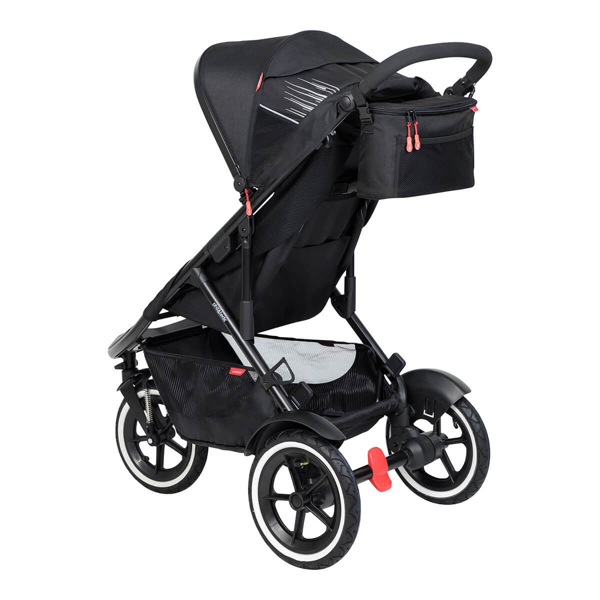 Black three-wheeled stroller in Phil&Teds Caddy with Odyssey wagon wheels