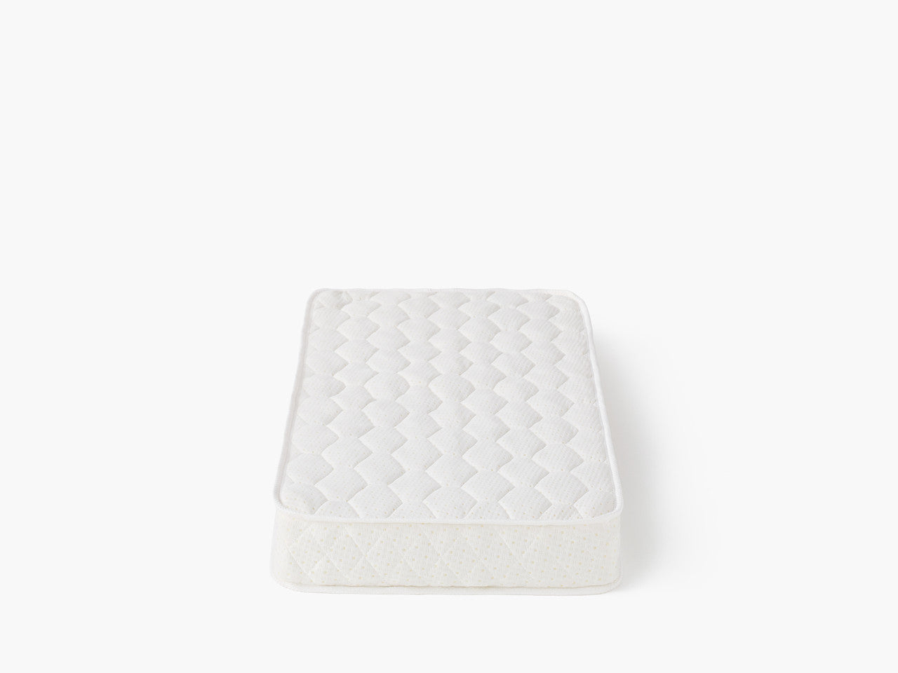 White mattress with quilted pattern from Tasman Eco Pisa Toshi Baby free standard mattress package