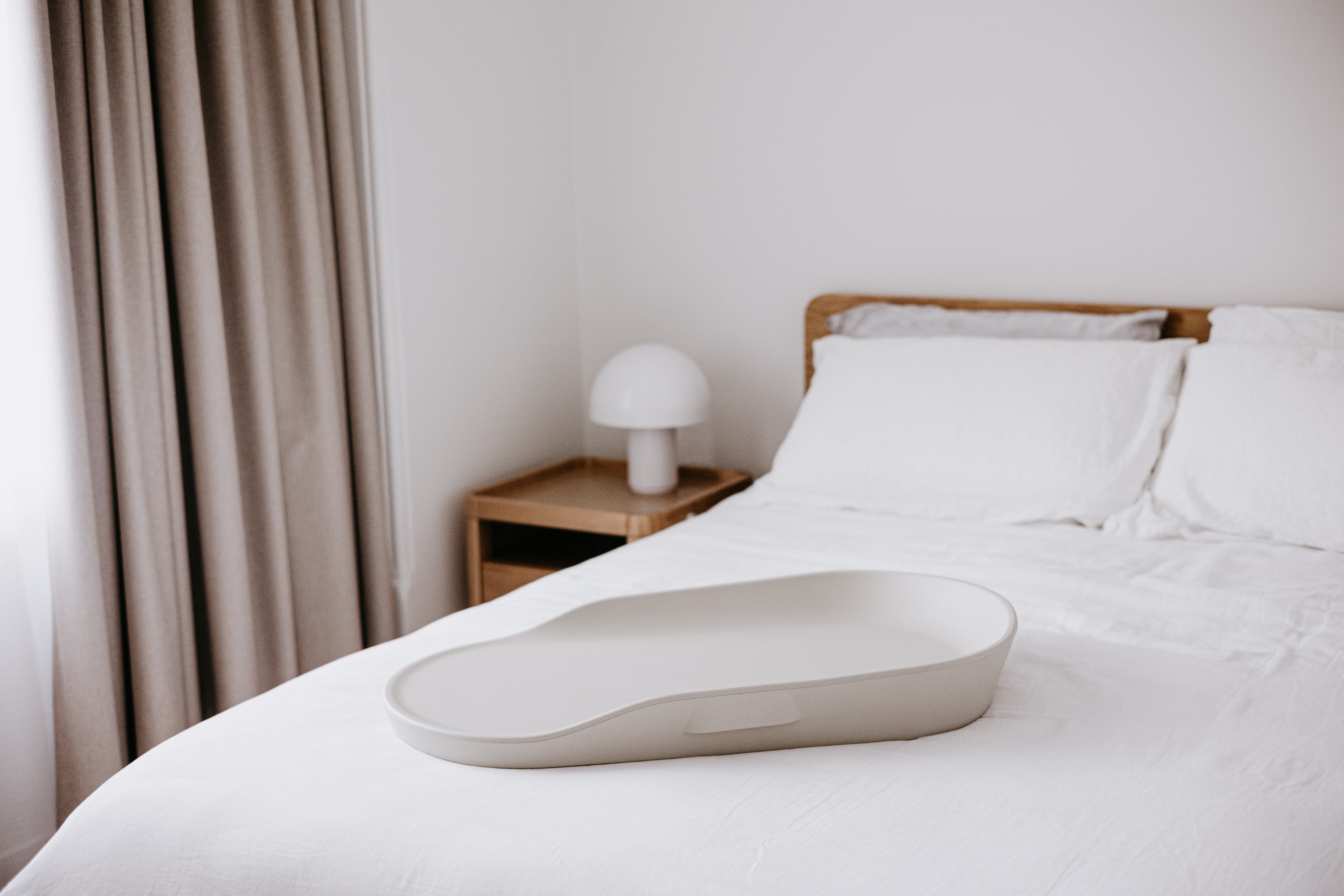 Oval gray changing tray on Tasman Eco Touzy Change Mat for Toshi Baby