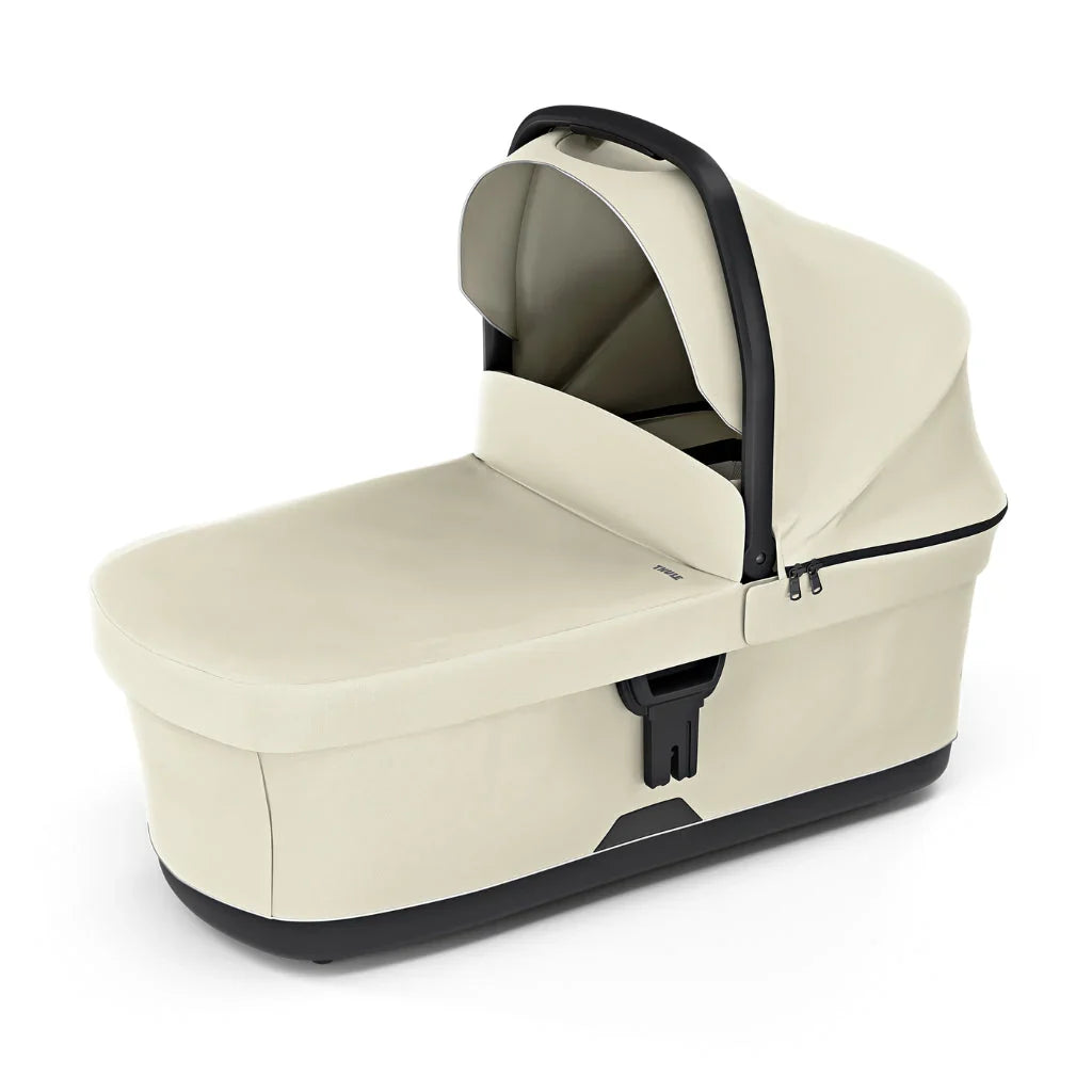 Beige baby stroller bassinet on Thule Urban Glide 3 with Toshi Baby Romper, perfect for baby strollers