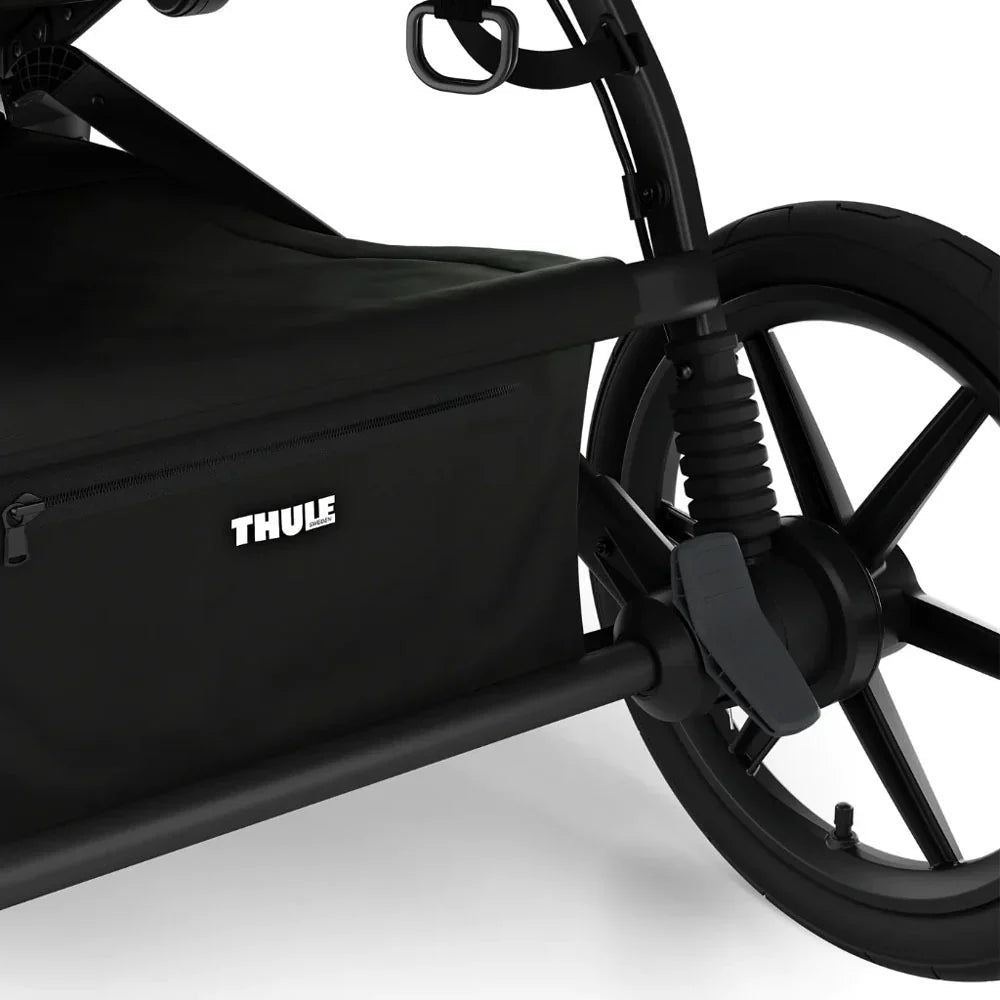 Black Thule Urban Glide all-terrain stroller with spacious storage compartment for baby strollers