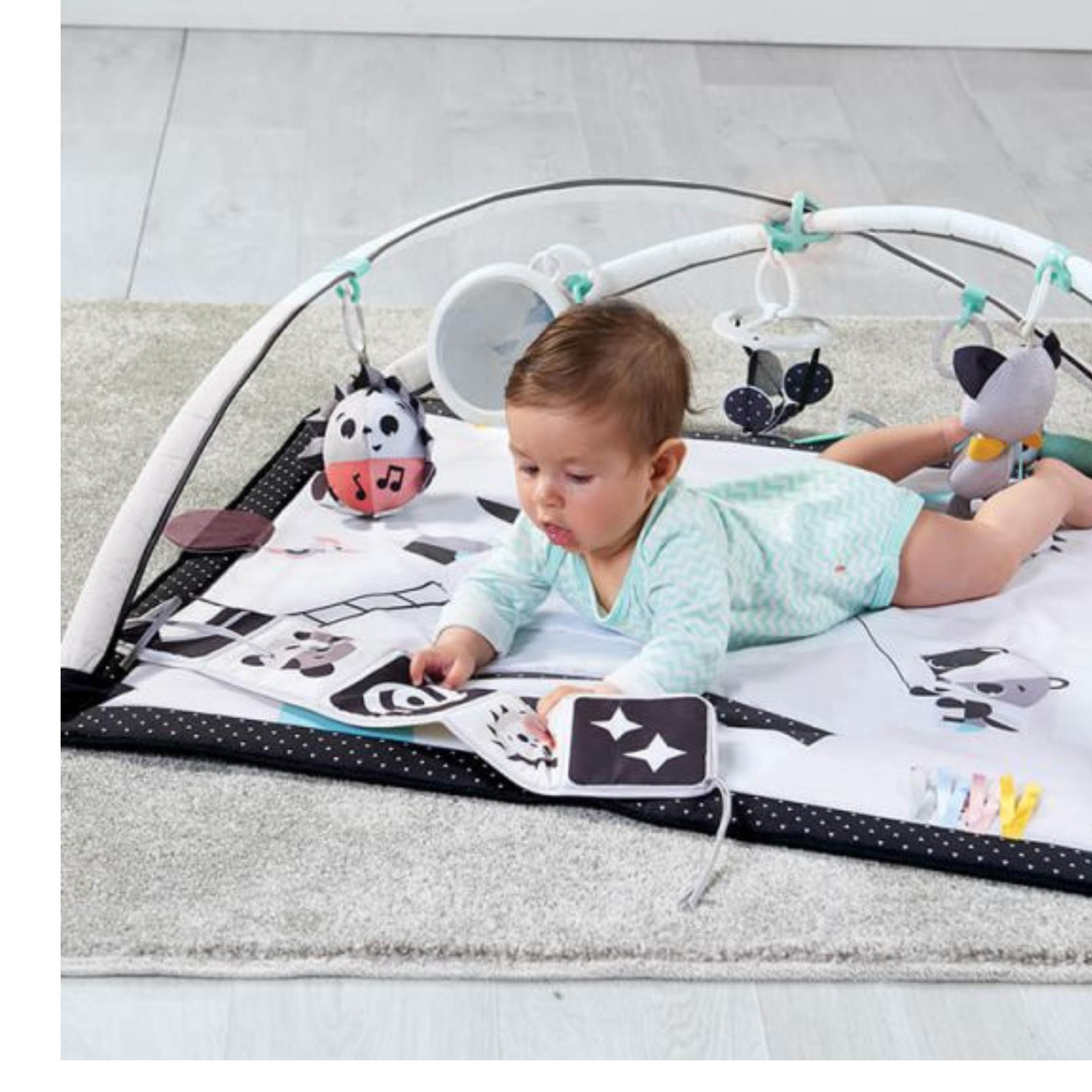Baby playing on tiny love gymini magical tales black and white for toshi baby fun