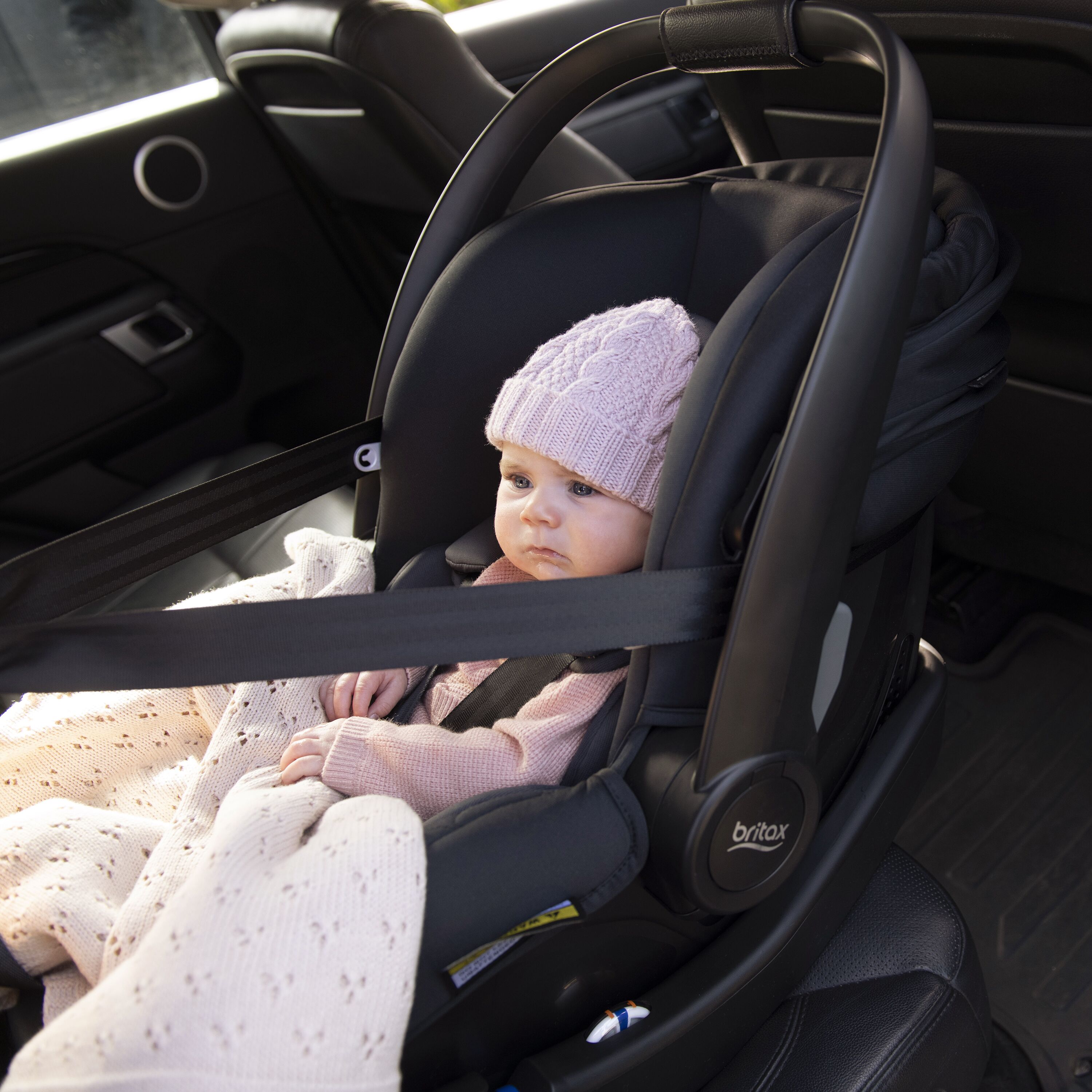 Baby in car seat with Britax Safe-n-Sound b-pod capsule, best for odyssey wagon wheels errands