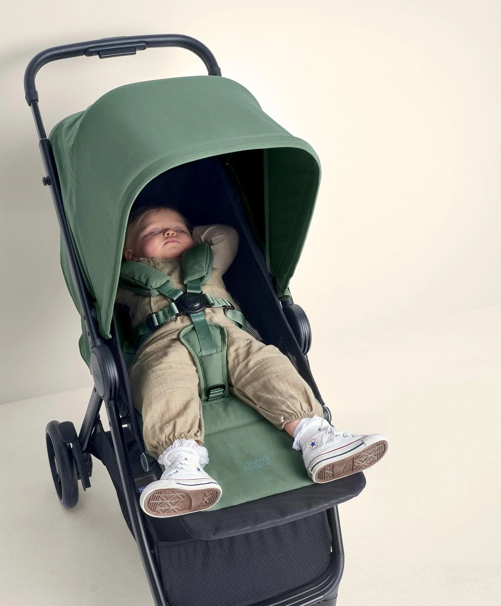 Green Mamas and Papas Libro Stroller with sleeping baby, comfy lay-flat seat recline