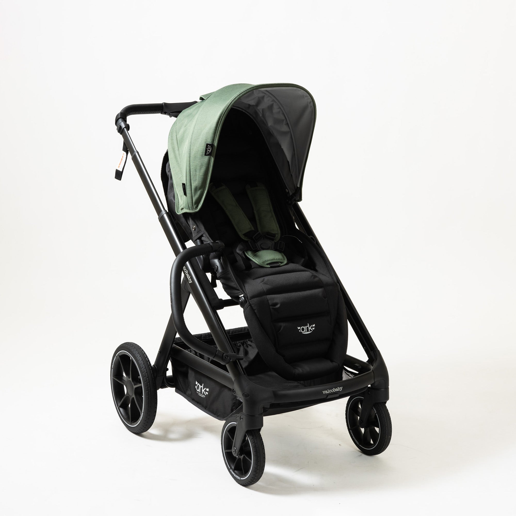 Green and black baby stroller from Valcobaby ARK Joey Seat Bundle, perfect for Toshi Baby