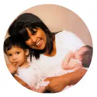 Smiling mother with two children.