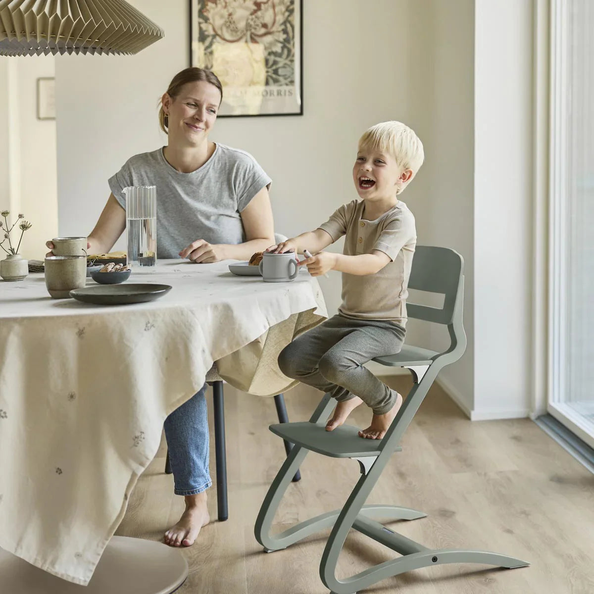 Green child s high chair from Leander Louie Highchair, great with Toshi baby romper