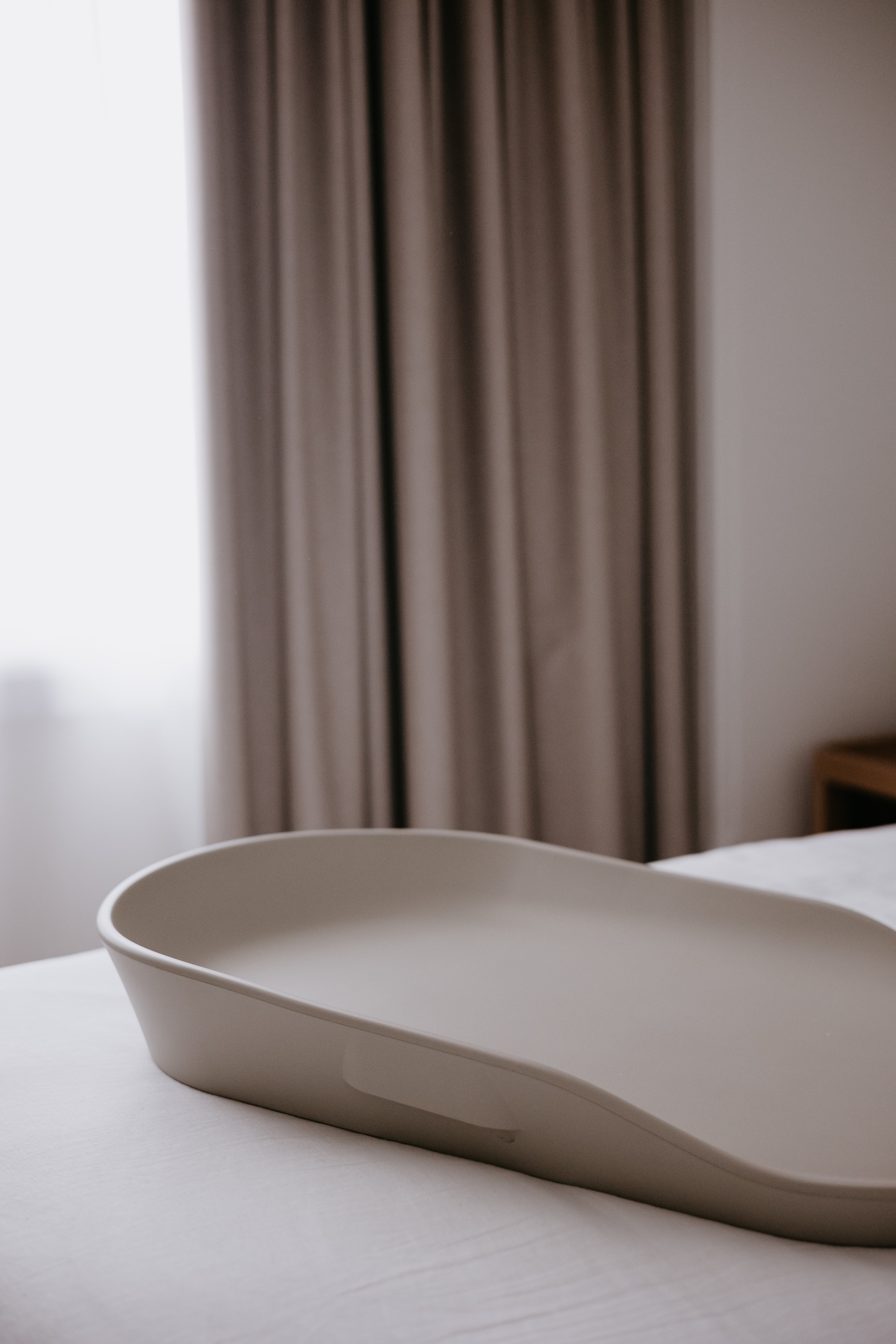 Beige changing tray on Tasman Eco Touzy Change Mat for baby strollers